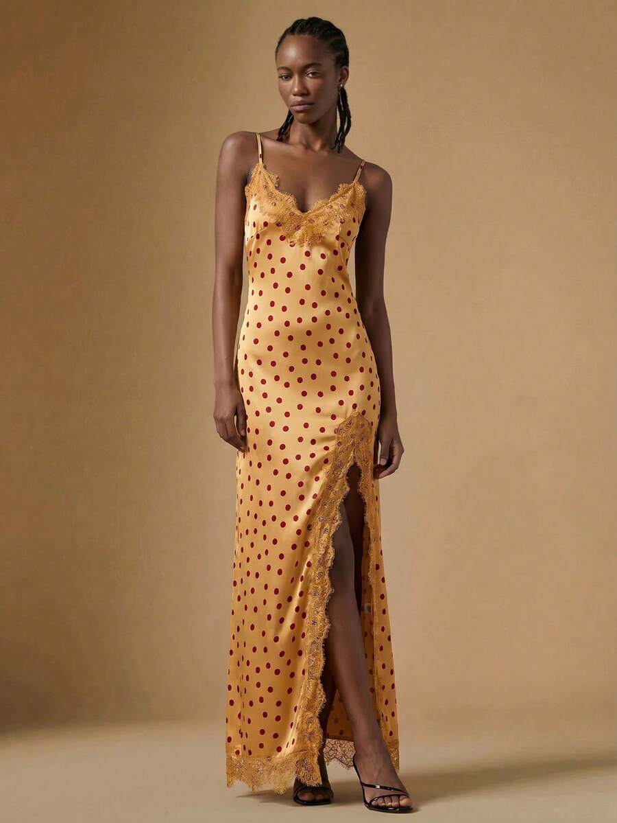Women's black lace split satin long dress featuring spaghetti straps, asymmetrical slit hem, and matching arm sleeves.