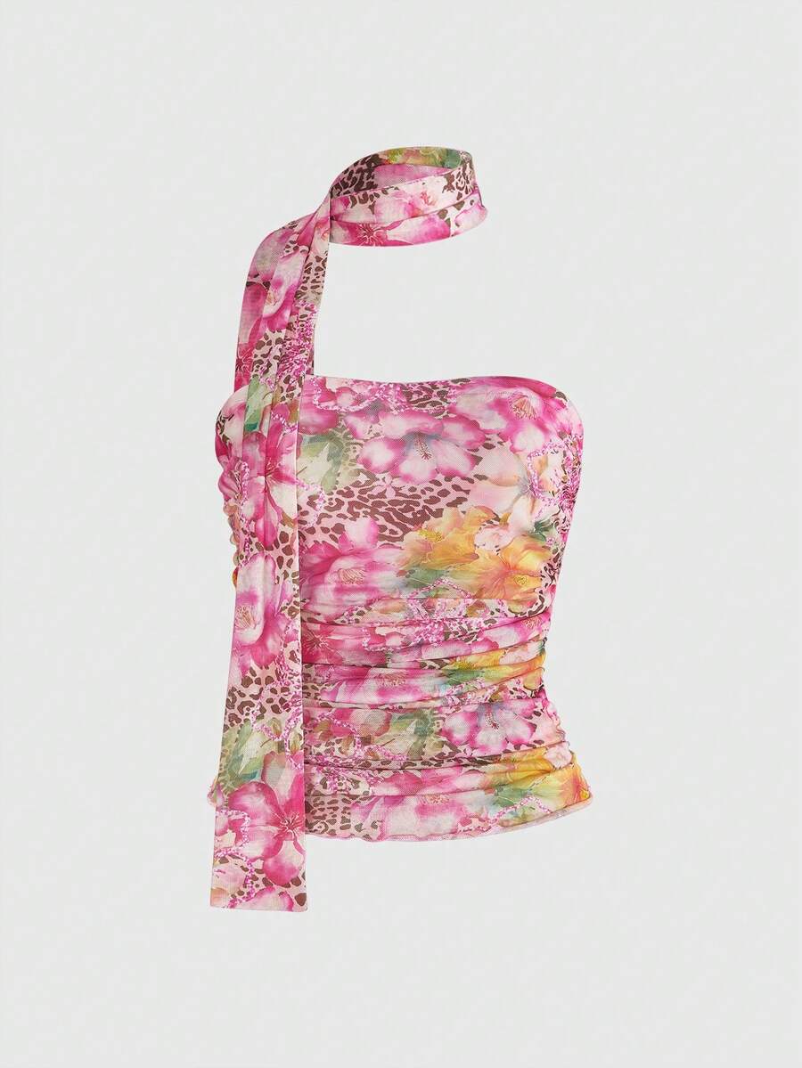 Women's black polka dot strapless tube top made of ruched mesh fabric featuring an asymmetrical hem and matching scarf.