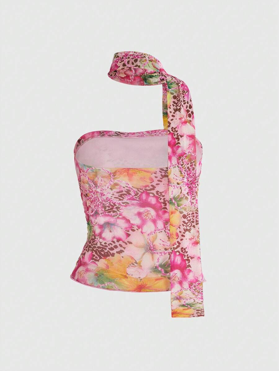 Women's black polka dot strapless tube top made of ruched mesh fabric featuring an asymmetrical hem and matching scarf.