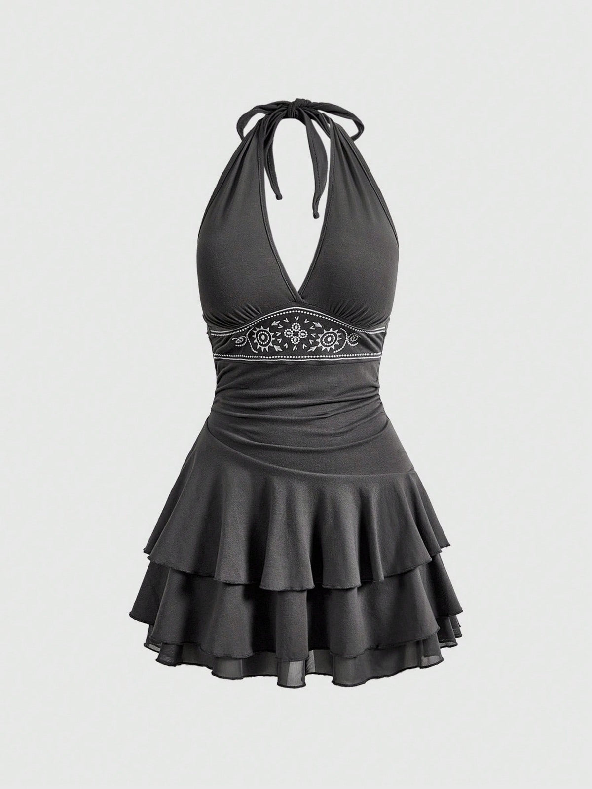 Women's sun totem embroidered sleeveless layered mini dress featuring a halter neck, backless tie back design, and slim fit high-waist A-line silhouette.