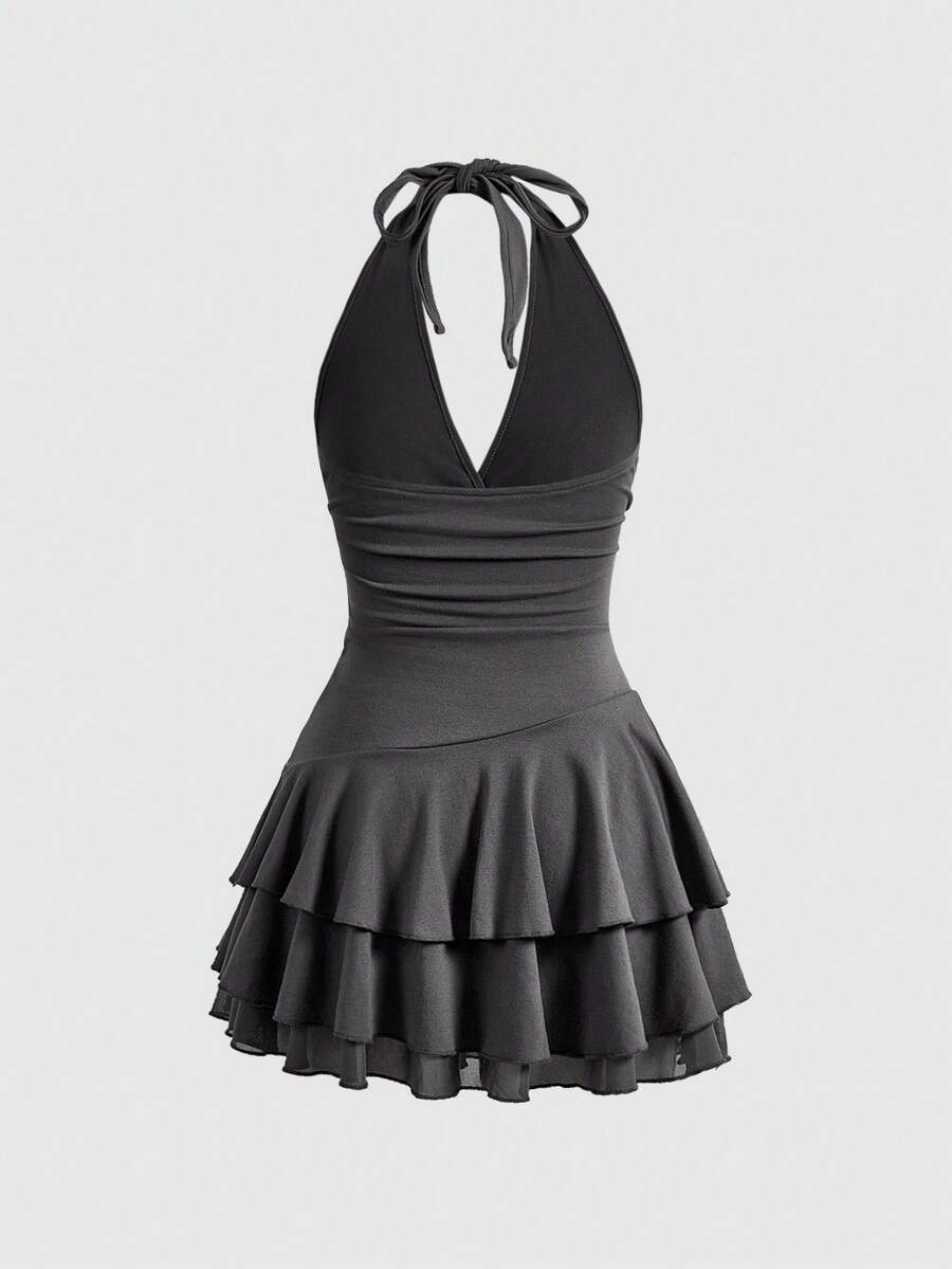 Women's sun totem embroidered sleeveless layered mini dress featuring a halter neck, backless tie back design, and slim fit high-waist A-line silhouette.