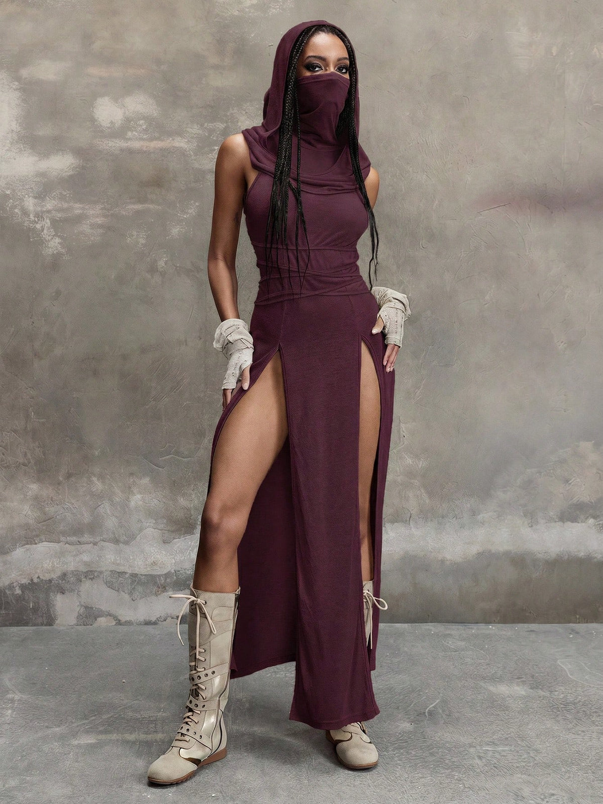 Women wearing a Y2K vintage apocalyptic style hooded long dress featuring short sleeves, backless detail, high thigh slit, and slim fit knitted fabric.
