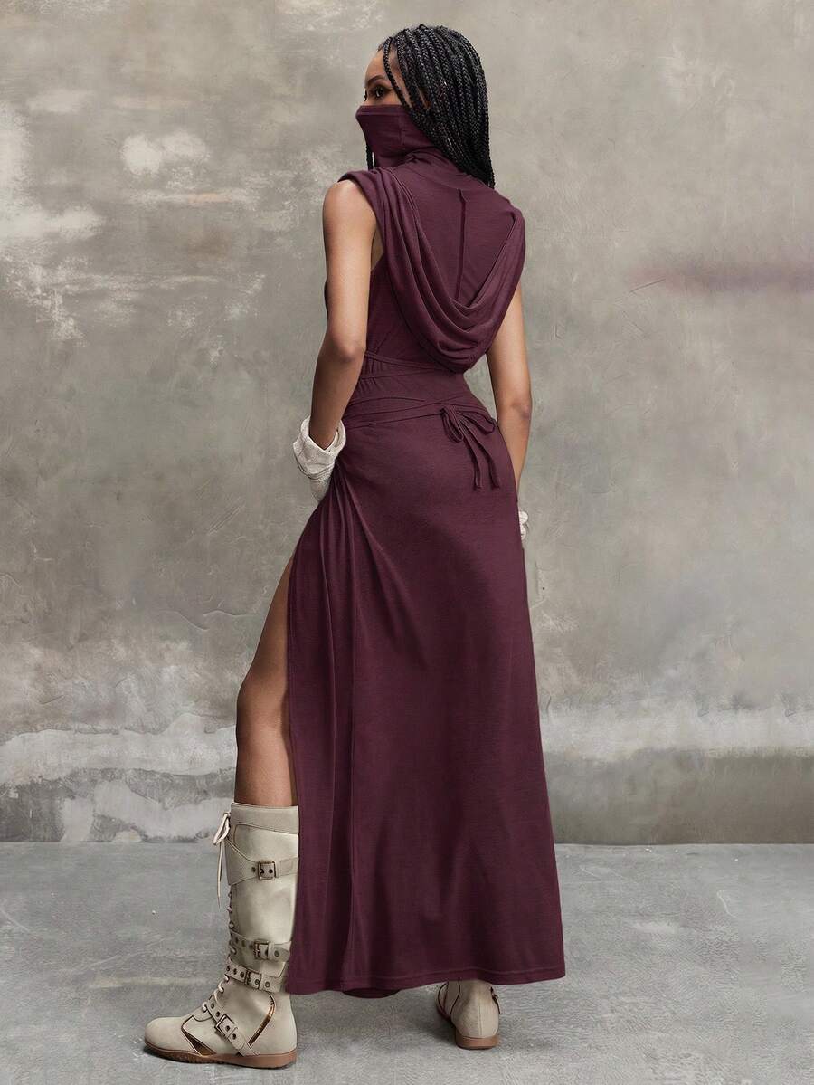 Women wearing a Y2K vintage apocalyptic style hooded long dress featuring short sleeves, backless detail, high thigh slit, and slim fit knitted fabric.