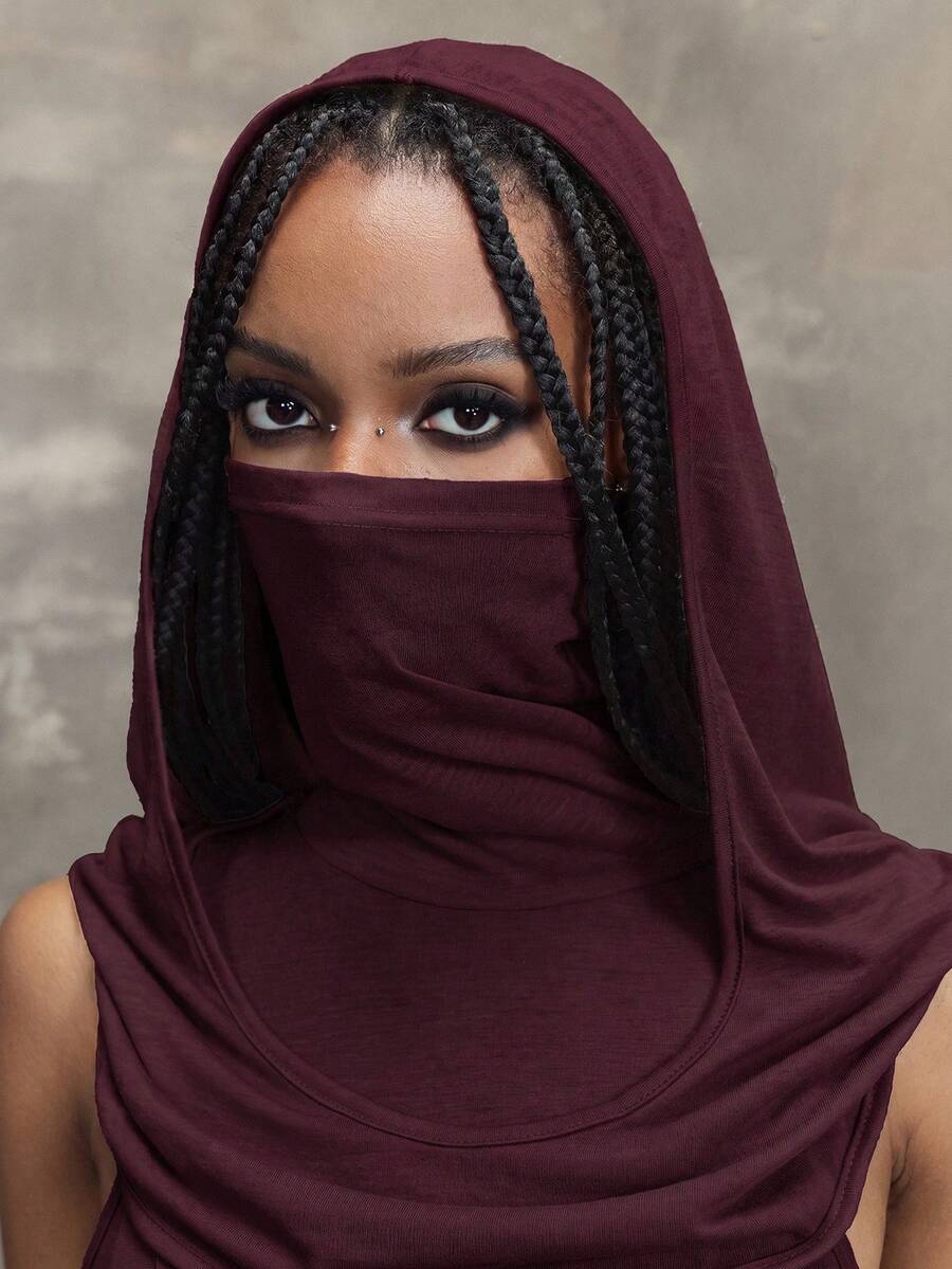 Women wearing a Y2K vintage apocalyptic style hooded long dress featuring short sleeves, backless detail, high thigh slit, and slim fit knitted fabric.