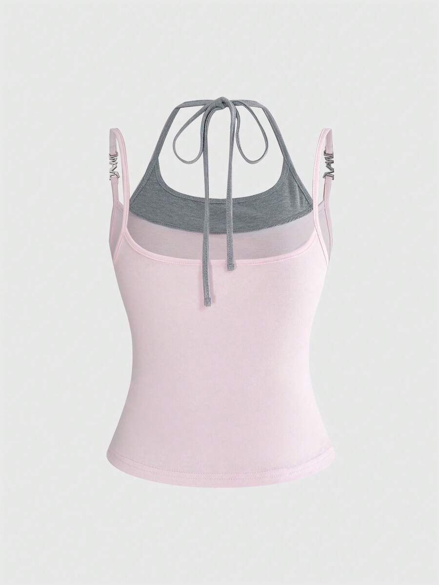 Black halter crop tank top featuring lace-up front details, ruched texture, eye appliques, and matching detached arm sleeves.