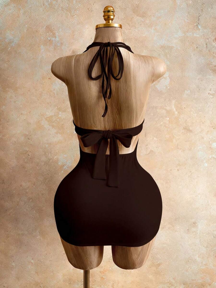 Sleeveless women's halter backless bodycon mini dress featuring lace-up knot back details and a high-waist pencil hem.