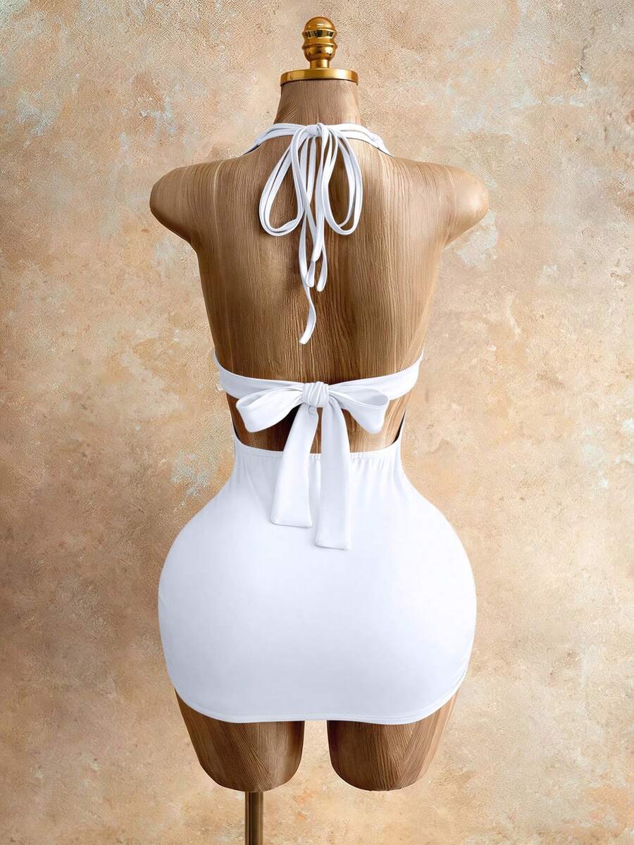 Sleeveless women's halter backless bodycon mini dress featuring lace-up knot back details and a high-waist pencil hem.