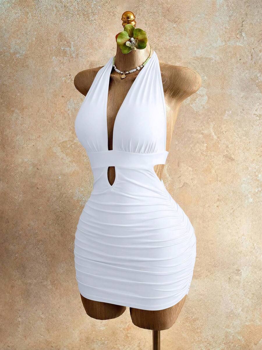 Sleeveless women's halter backless bodycon mini dress featuring lace-up knot back details and a high-waist pencil hem.