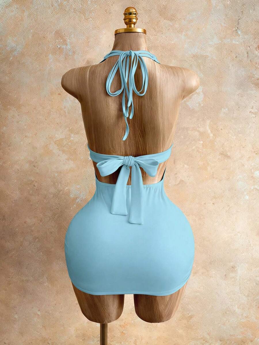 Sleeveless women's halter backless bodycon mini dress featuring lace-up knot back details and a high-waist pencil hem.