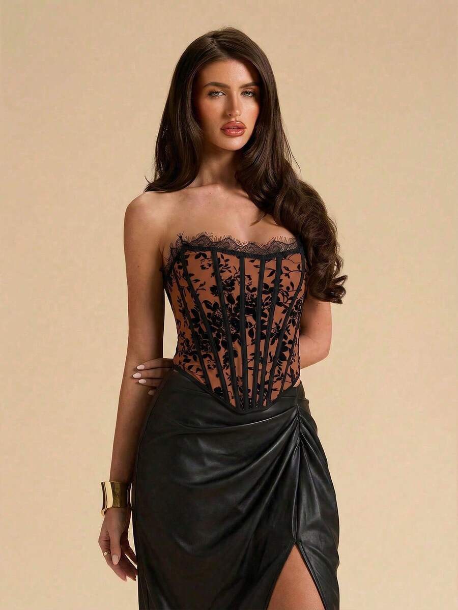 Women's strapless bustier crop top with contrast lace, lace-up detail, and an asymmetric hem in a slim-fit satin finish.