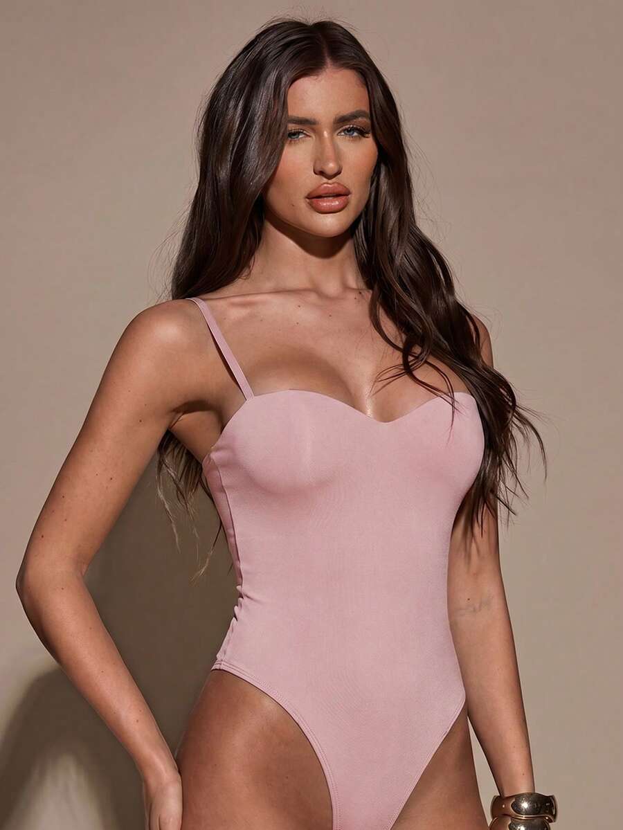 Apricot women's lace sheer camisole top featuring spaghetti straps, contrast lace trim, backless slim fit design, and knitted stretch fabric.