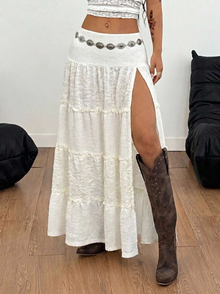 Women's black low waist split thigh long skirt featuring semi-sheer textured fabric and a flared skinny fit.