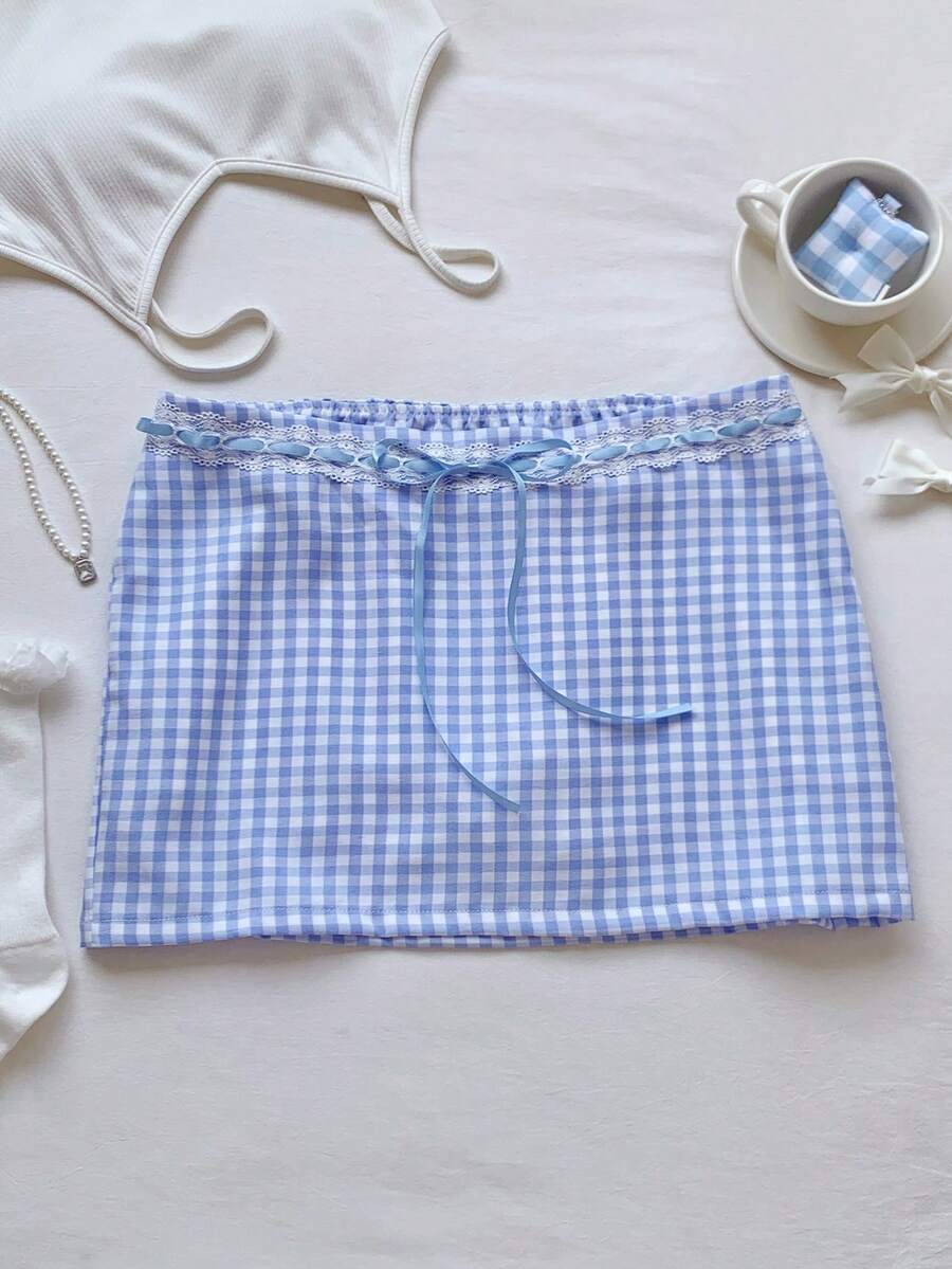 Women's white 100% cotton low waist mini skirt featuring a tropical print and zipper detail.