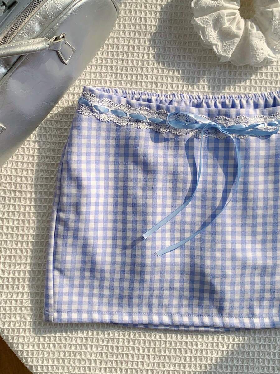 Women's white 100% cotton low waist mini skirt featuring a tropical print and zipper detail.