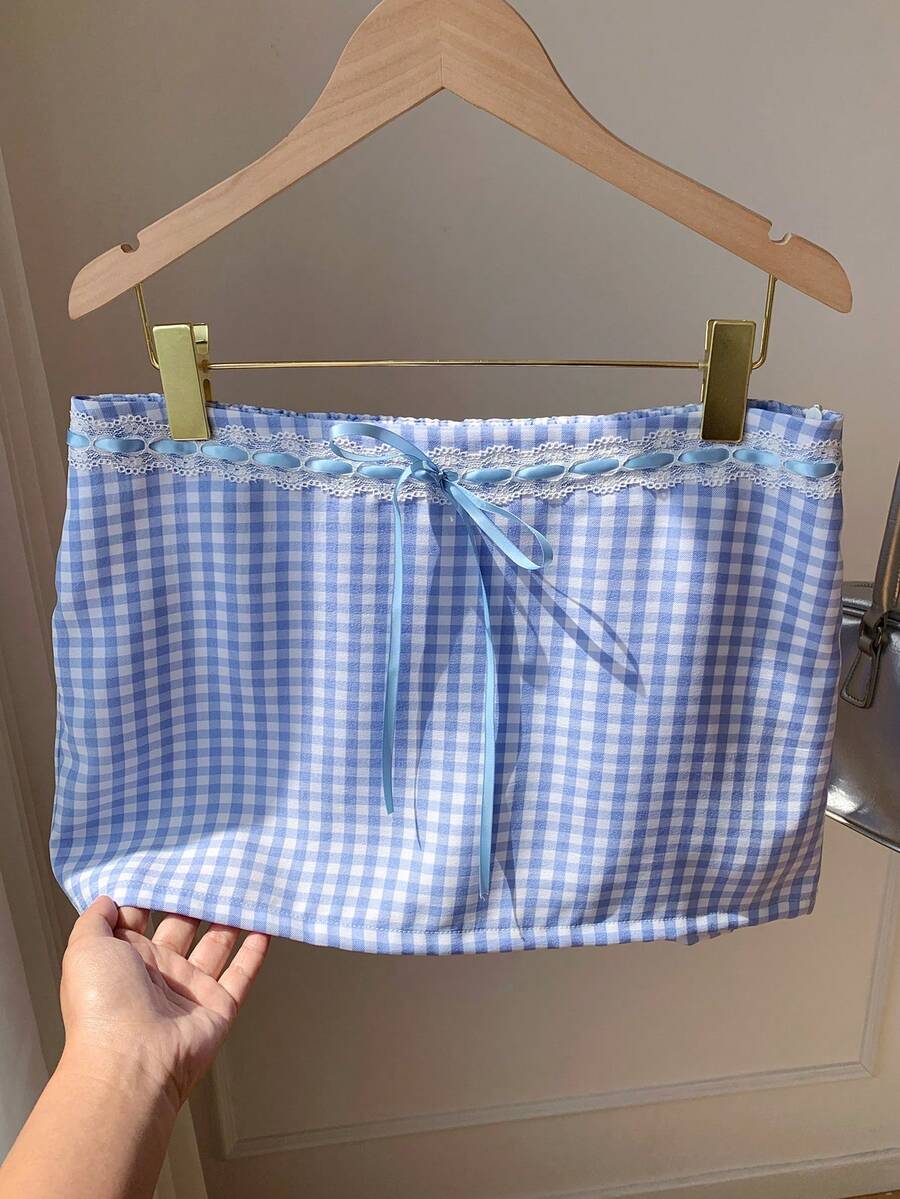 Women's white 100% cotton low waist mini skirt featuring a tropical print and zipper detail.