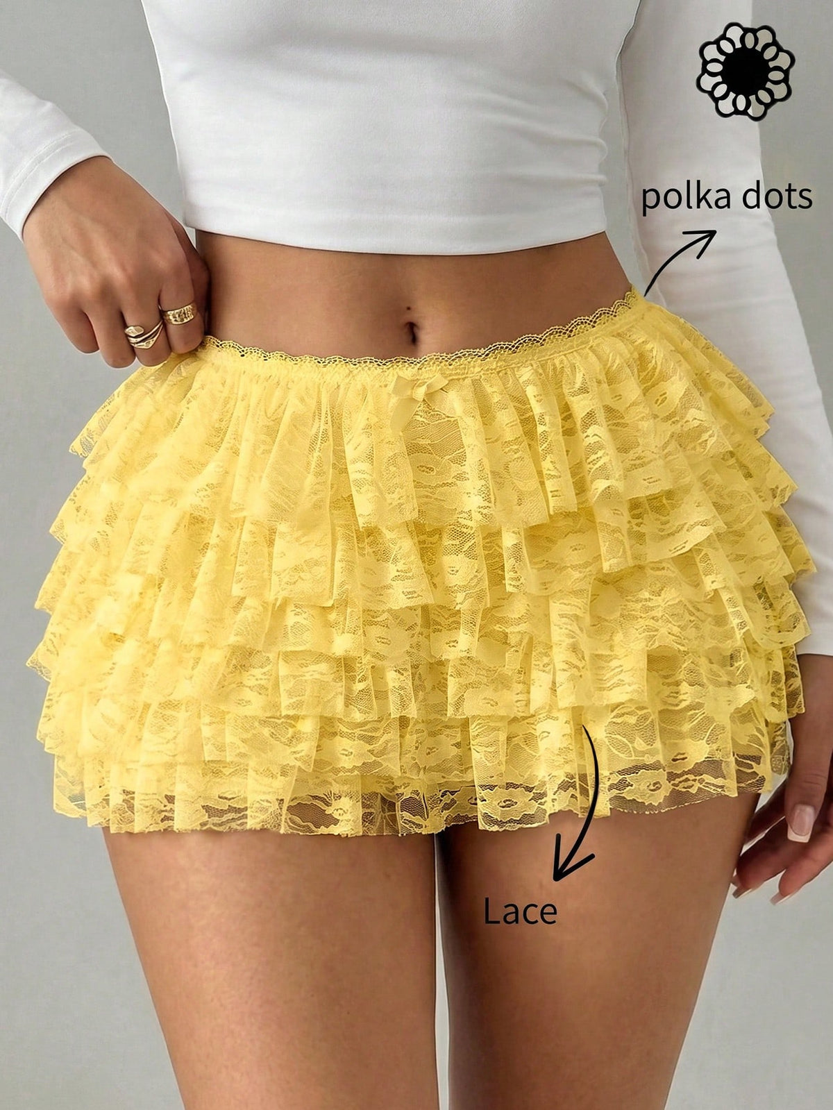 Apricot tiered lace ruffle hem low waist shorts for women featuring elastic waist and lined semi-sheer knit fabric.