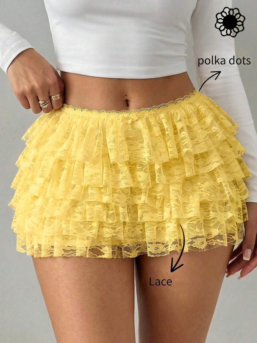 Apricot tiered lace ruffle hem low waist shorts for women featuring elastic waist and lined semi-sheer knit fabric.