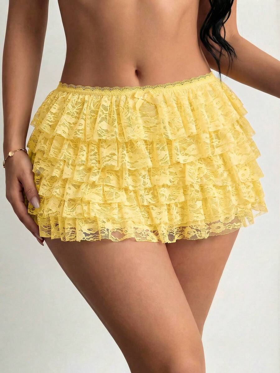 Apricot tiered lace ruffle hem low waist shorts for women featuring elastic waist and lined semi-sheer knit fabric.