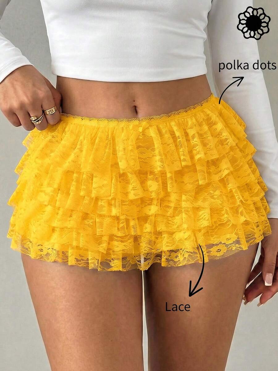 Apricot tiered lace ruffle hem low waist shorts for women featuring elastic waist and lined semi-sheer knit fabric.