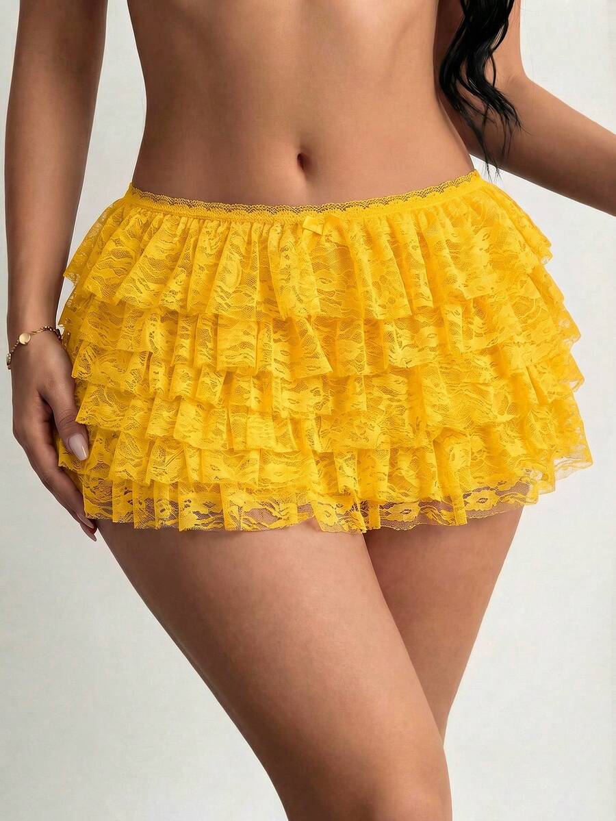 Apricot tiered lace ruffle hem low waist shorts for women featuring elastic waist and lined semi-sheer knit fabric.