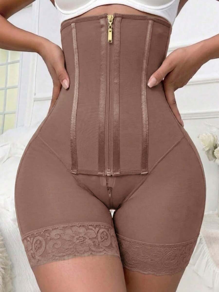Women's high waist shaping shorts in apricot with zipper closure and tummy control features.