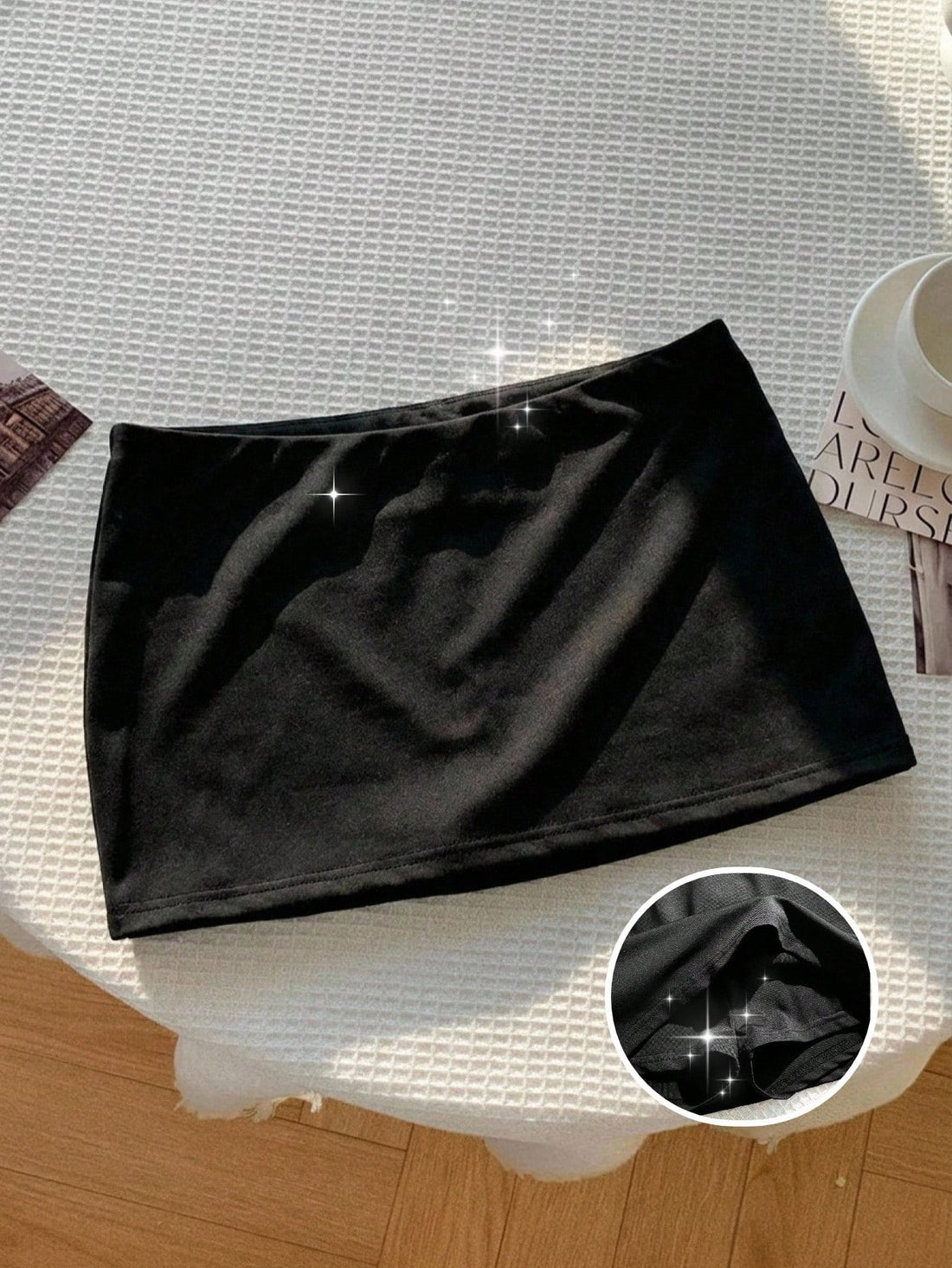 Tween girl solid black casual mini skirt featuring built-in shorts made from stretch fabric.