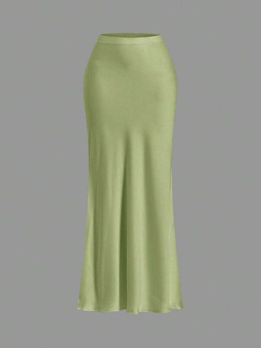 Women's black woven mermaid maxi skirt featuring a solid color design, mid waist, and 100% cotton fabric.