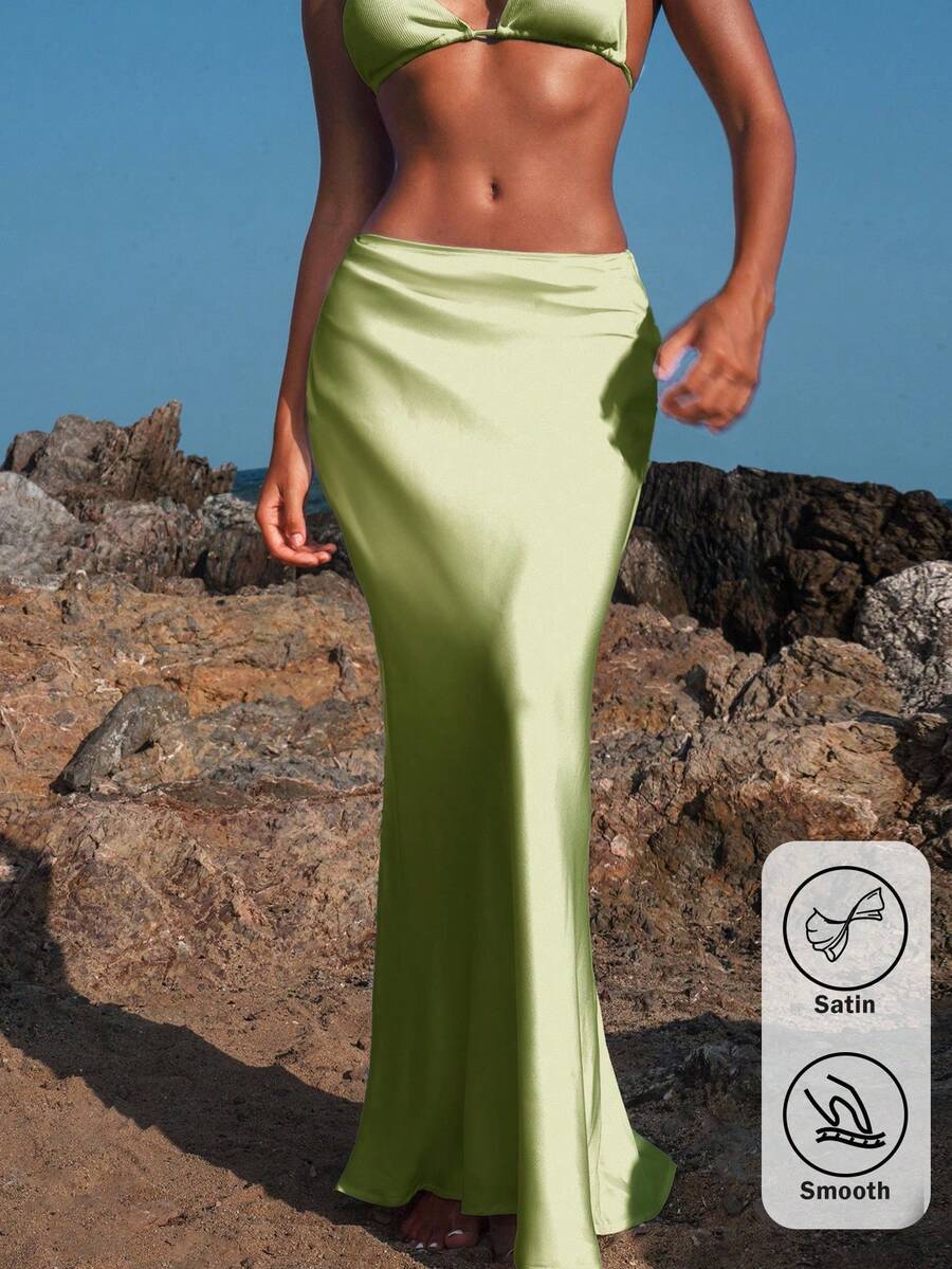 Women's black woven mermaid maxi skirt featuring a solid color design, mid waist, and 100% cotton fabric.
