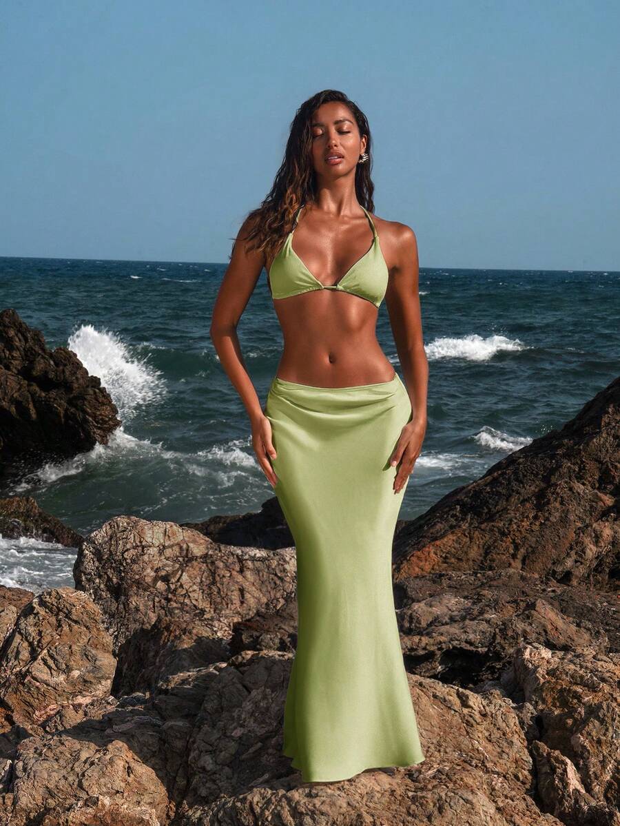 Women's black woven mermaid maxi skirt featuring a solid color design, mid waist, and 100% cotton fabric.