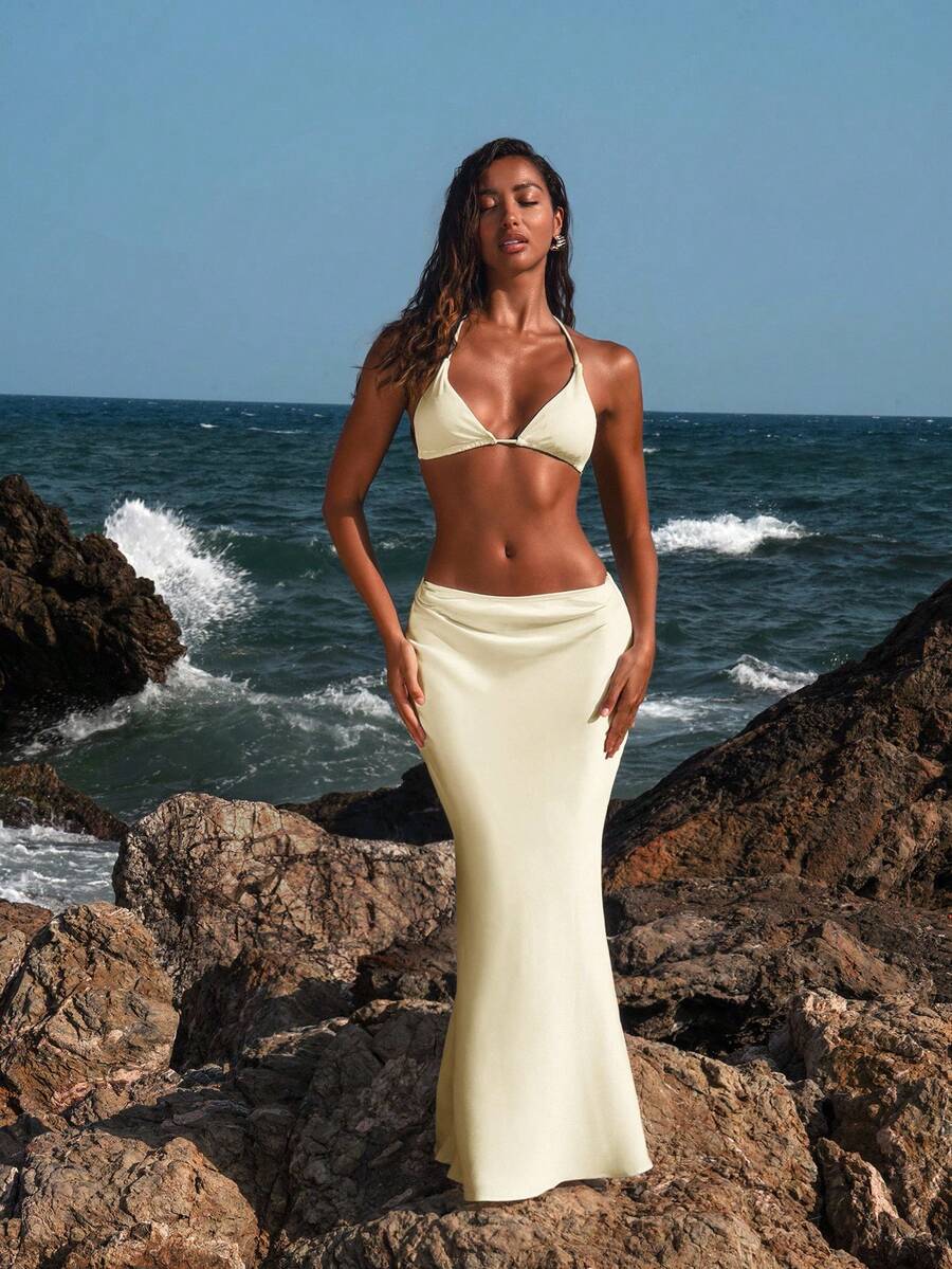 Women's black woven mermaid maxi skirt featuring a solid color design, mid waist, and 100% cotton fabric.
