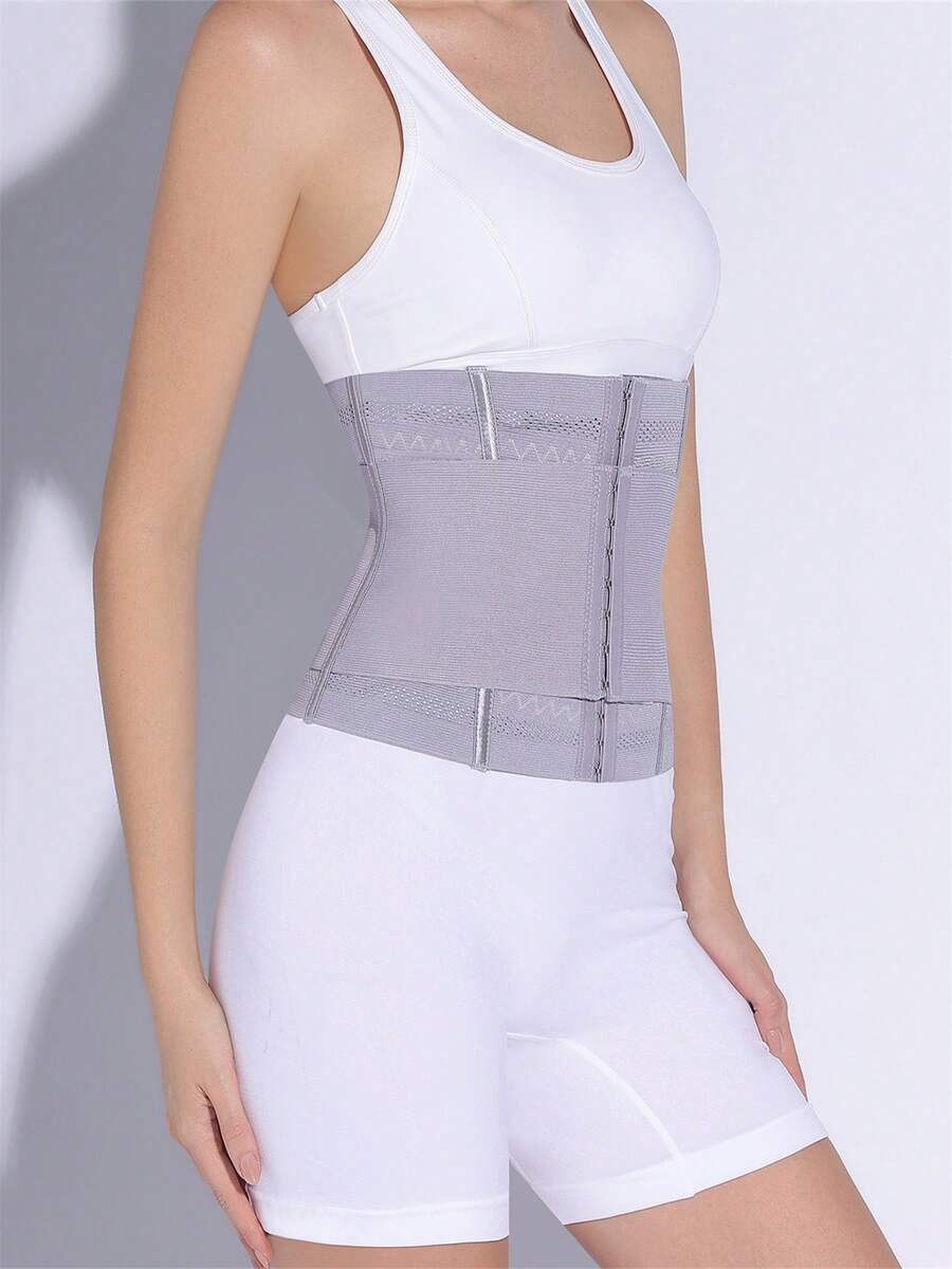 Black adjustable waist cincher shapewear for women made of high stretch knitted fabric for tummy and waist control.