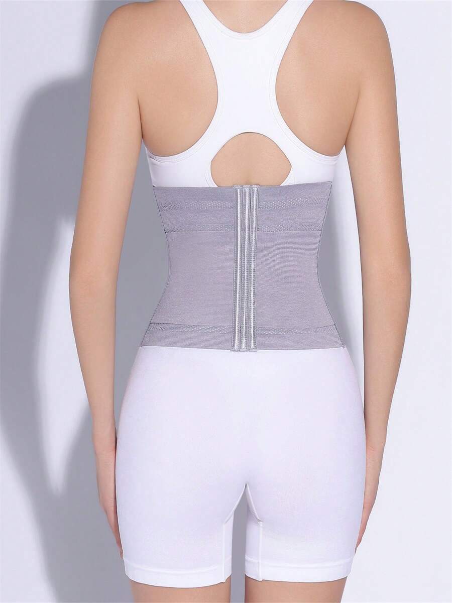 Black adjustable waist cincher shapewear for women made of high stretch knitted fabric for tummy and waist control.