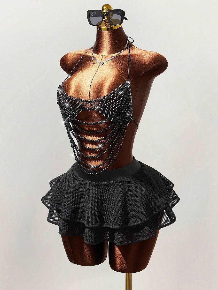 Women's black Y2K rhinestone layered mini skirt with hollow-out detailing and natural mid-waist design