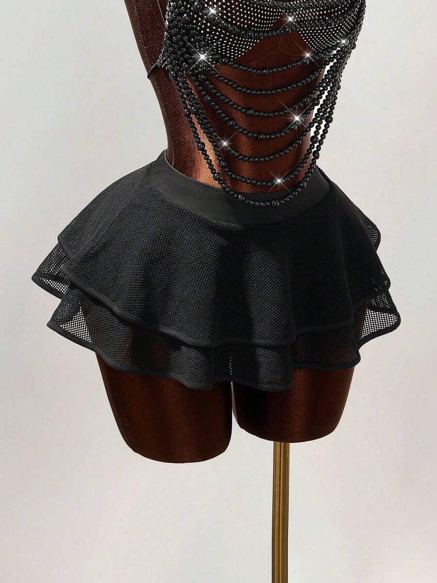 Women's black Y2K rhinestone layered mini skirt with hollow-out detailing and natural mid-waist design