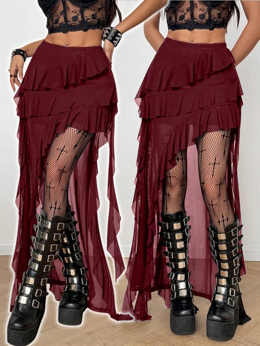 Women's black asymmetrical long skirt with ruffle hem and low waist design in knitted fabric.