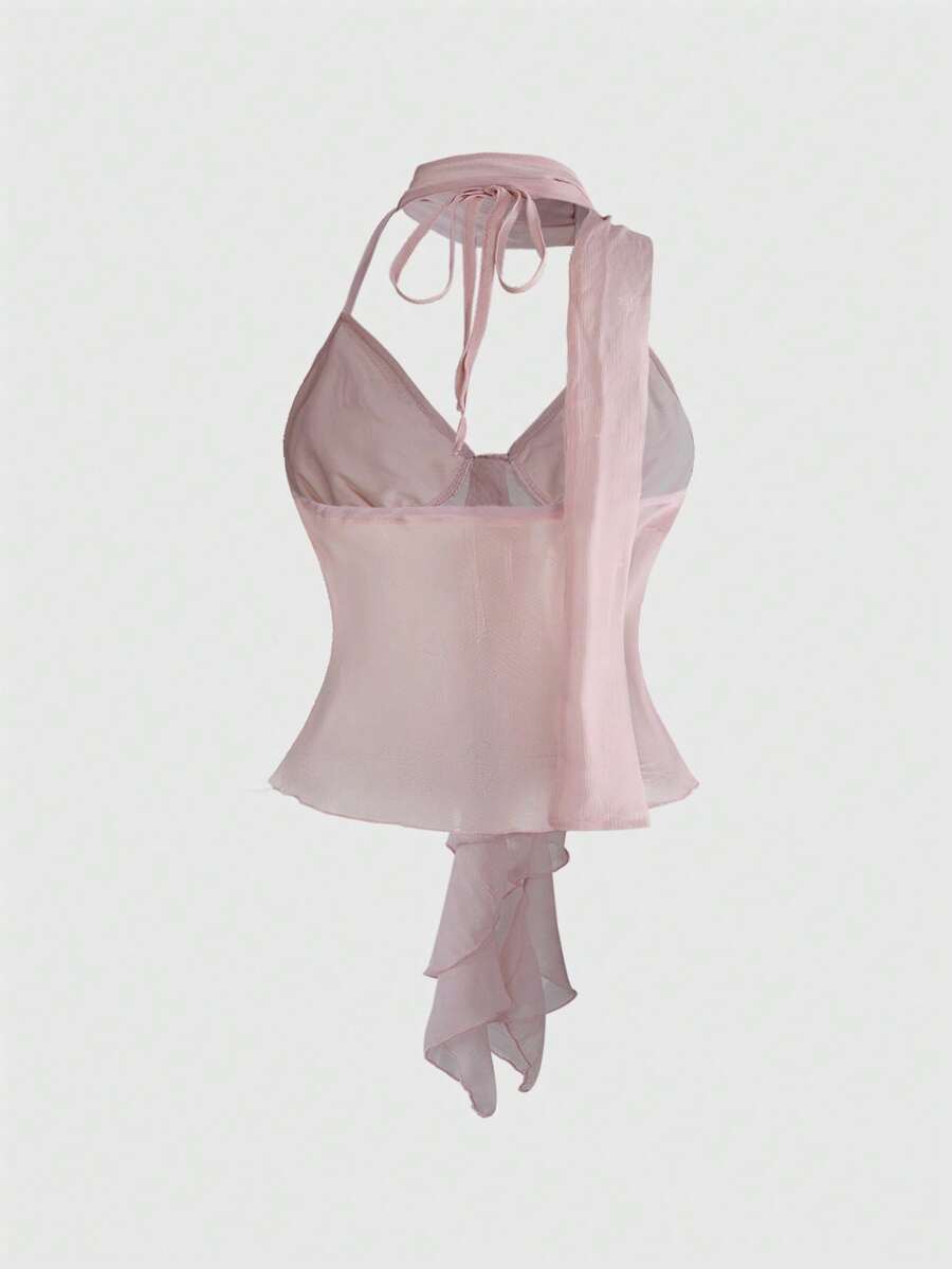 Black halter crop top featuring an asymmetrical ruffle hem and backless design for women.