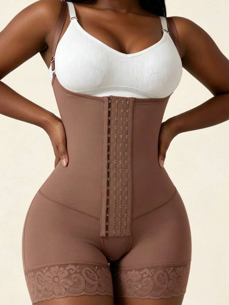 Women's apricot body shaper jumpsuit with 4-row hook and eye front closure and contrast lace details.
