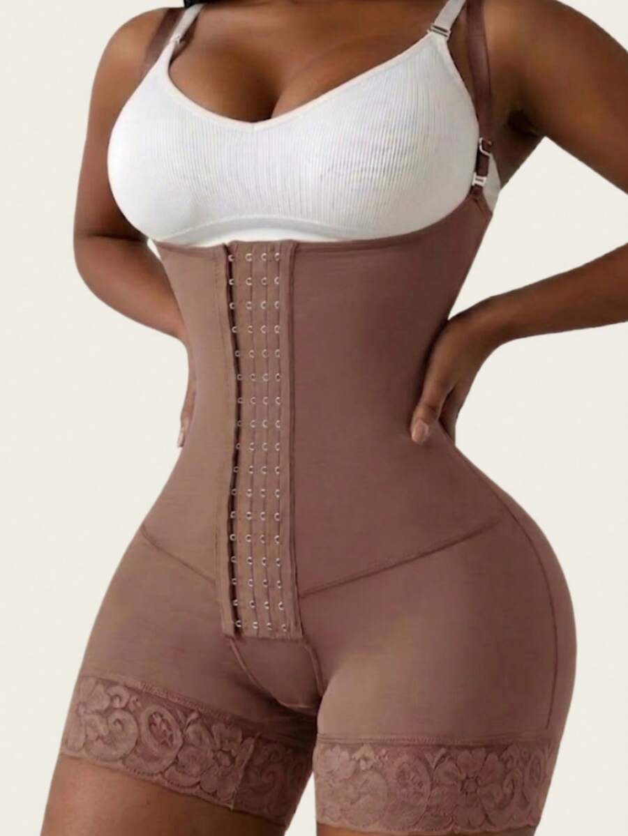 Women's apricot body shaper jumpsuit with 4-row hook and eye front closure and contrast lace details.