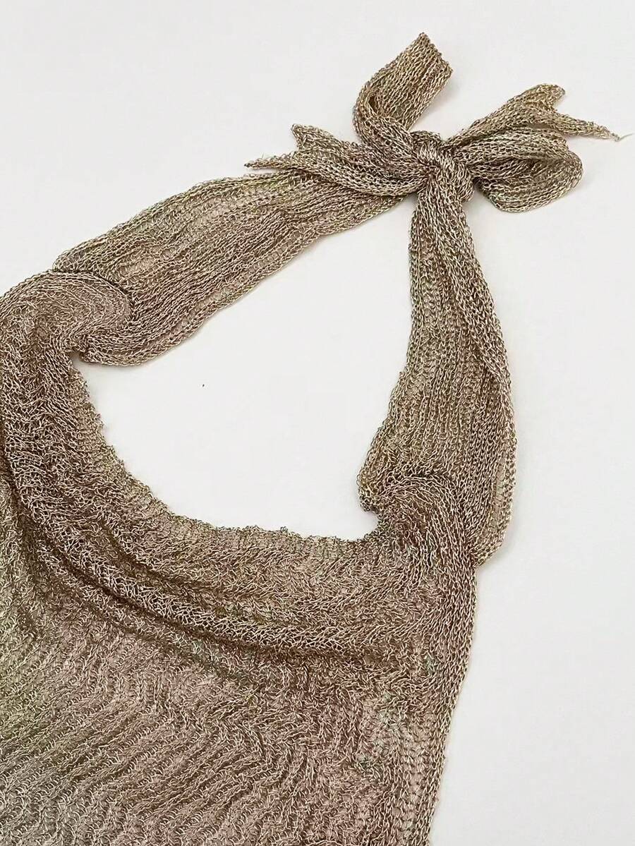 Women's cowl neck metallic knit tank top with thin spaghetti straps and a backless draped silhouette.
