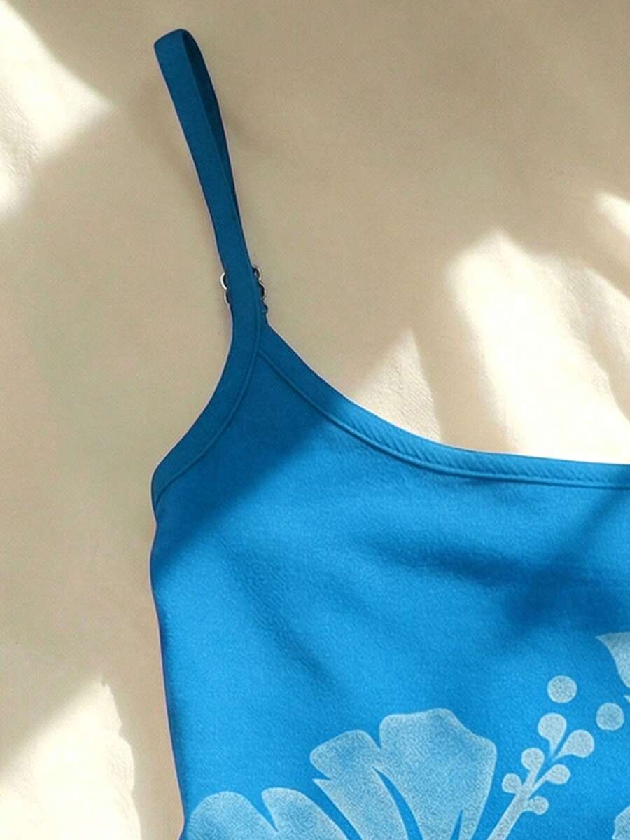 Women's blue floral print spaghetti strap camisole top in a slim fit short length design