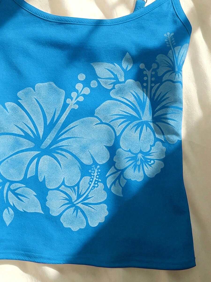 Women's blue floral print spaghetti strap camisole top in a slim fit short length design