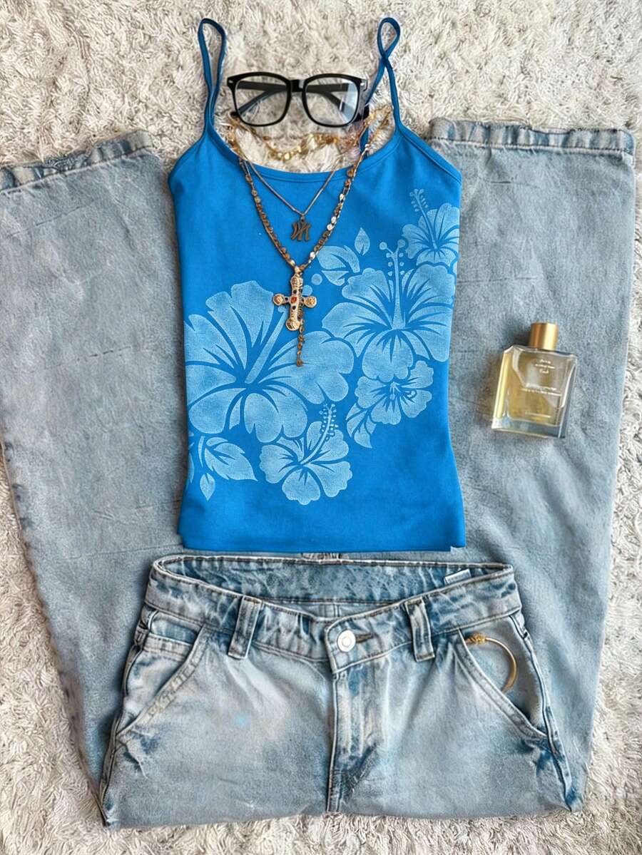 Women's blue floral print spaghetti strap camisole top in a slim fit short length design