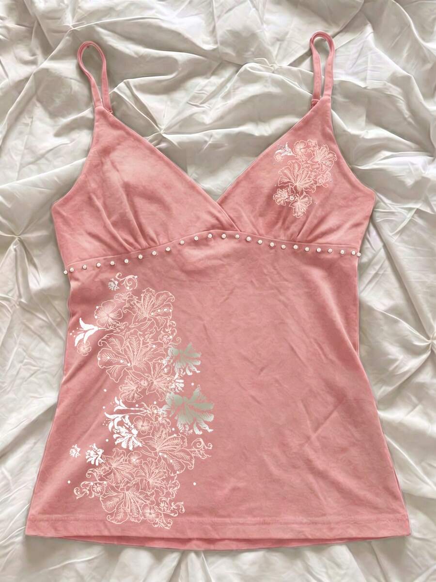 Women's slim fit spaghetti strap cami top featuring a tropical hibiscus floral graphic print.