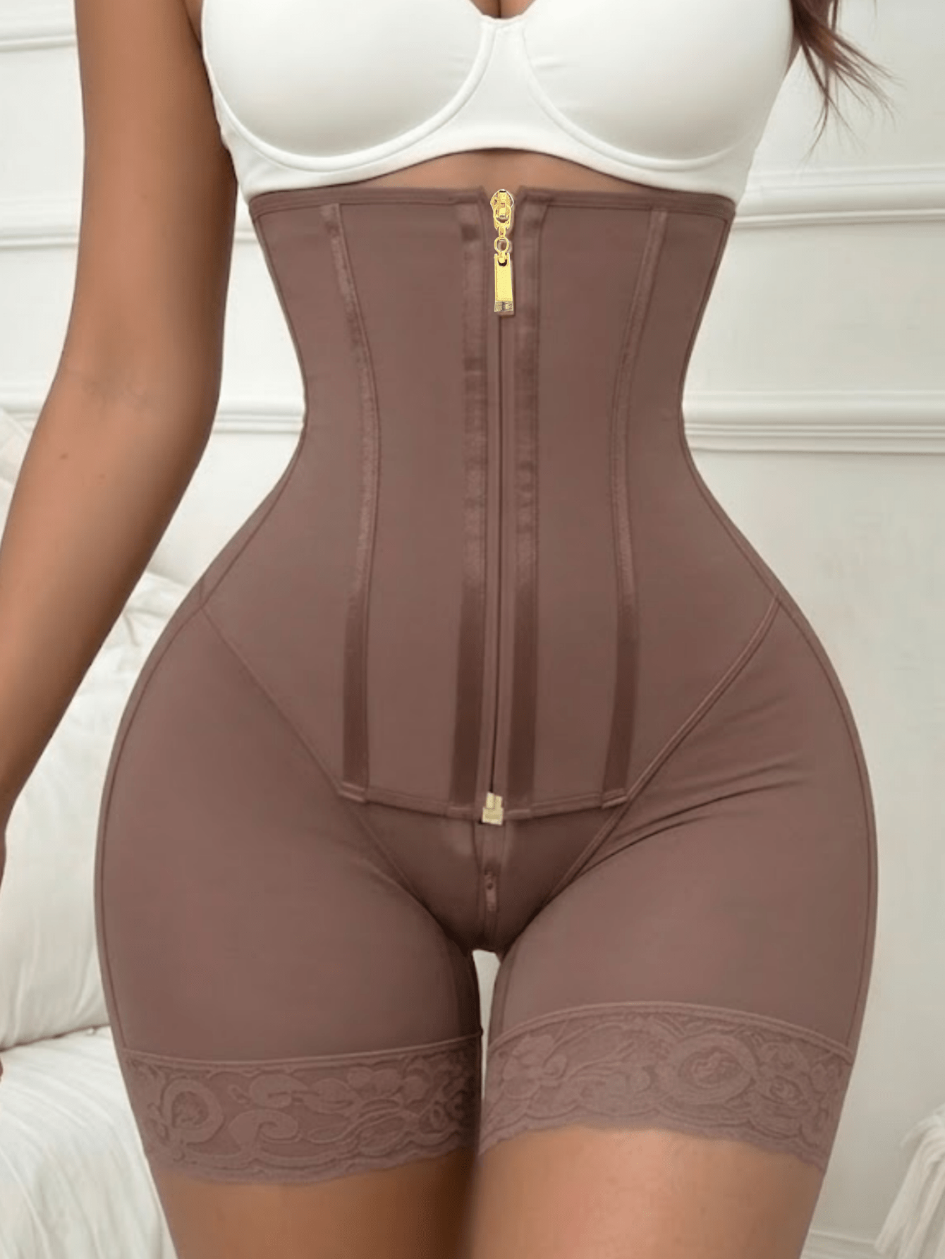 Women's high waist shaping shorts in apricot with zipper closure and tummy control features.