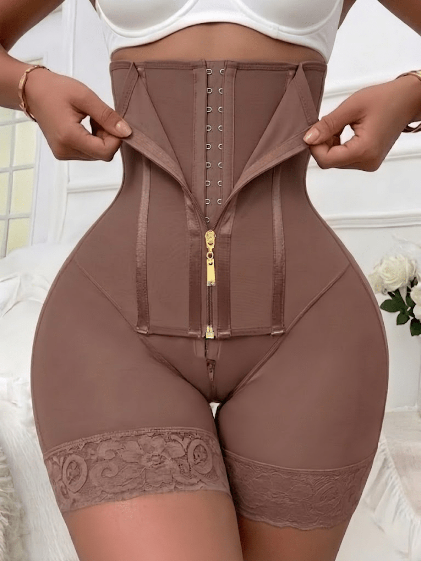Women's high waist shaping shorts in apricot with zipper closure and tummy control features.