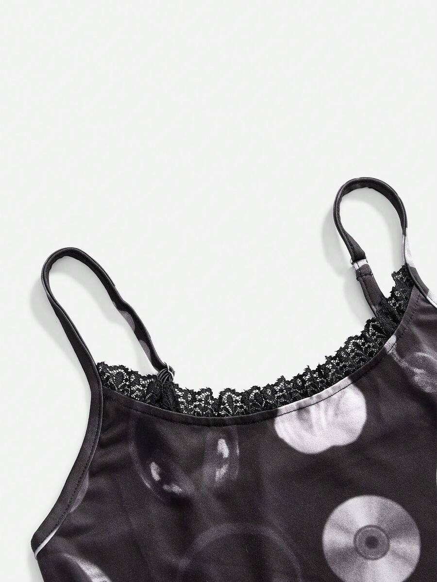 Women's black slim fit spaghetti strap cami top featuring contrast lace trim