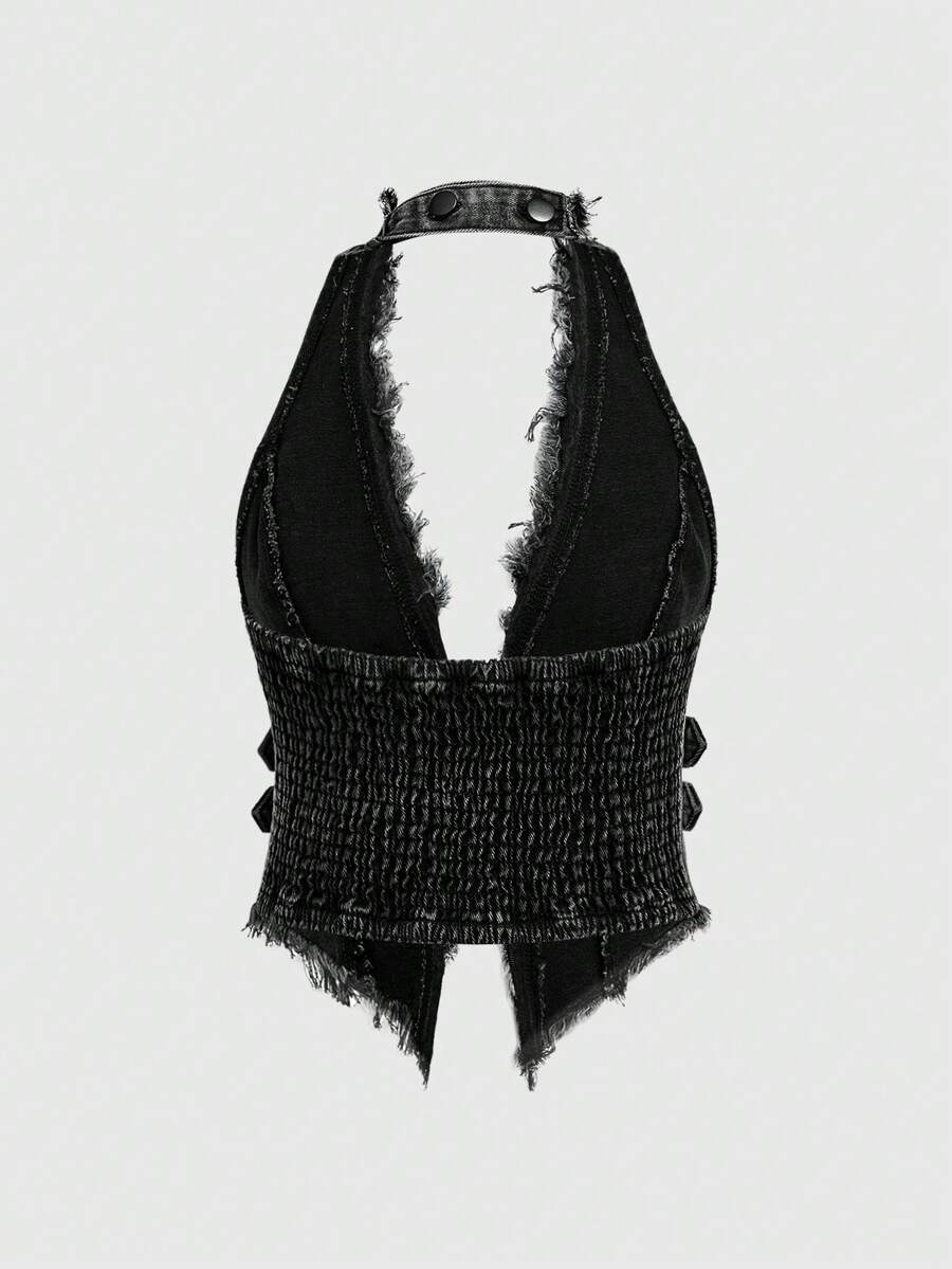 Women's denim halter crop top featuring a backless design, asymmetrical hem, single-breasted front, and lettuce trim.