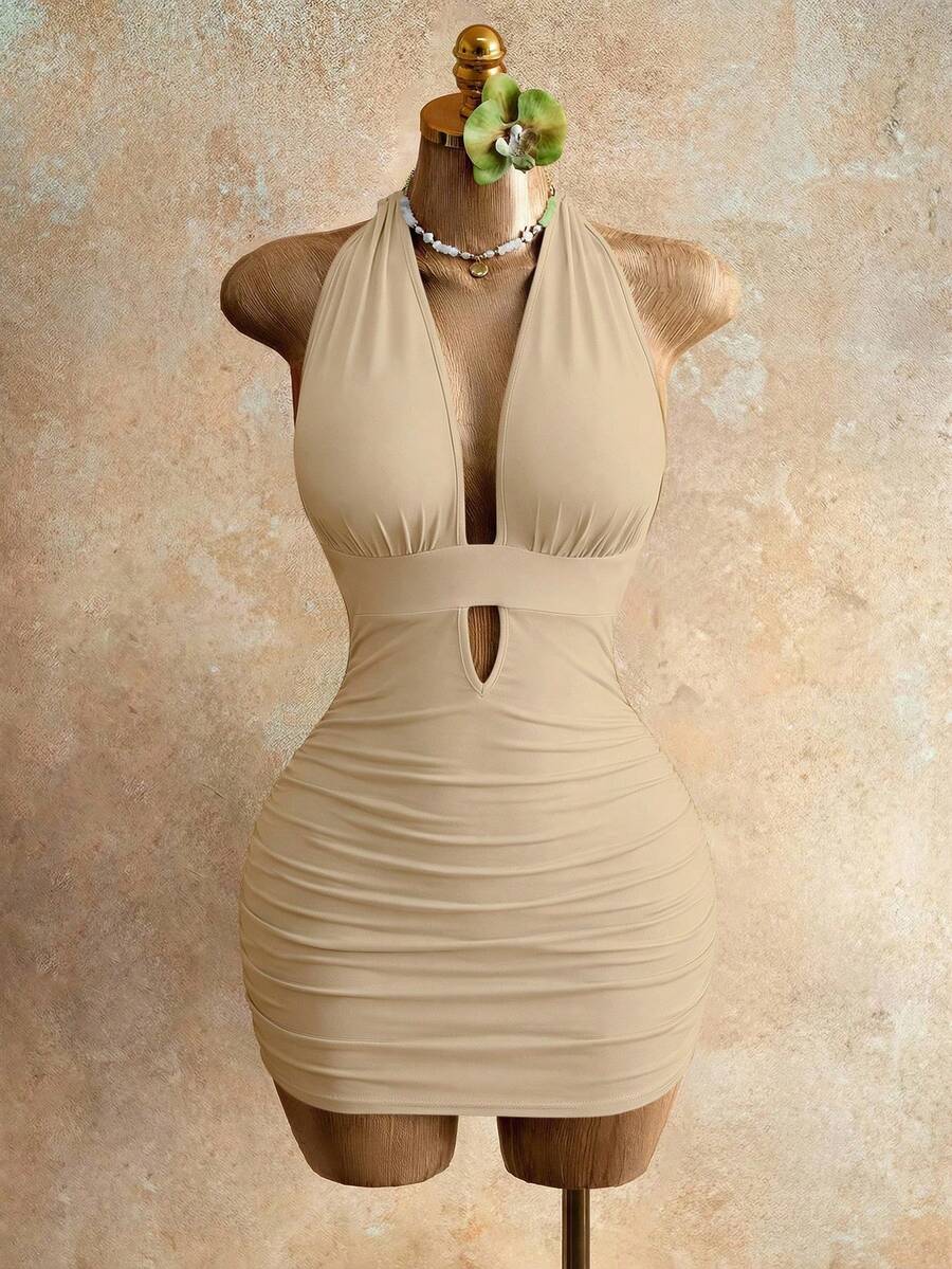 Sleeveless women's halter backless bodycon mini dress featuring lace-up knot back details and a high-waist pencil hem.