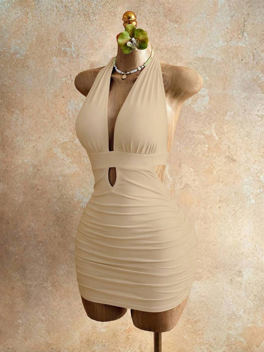Sleeveless women's halter backless bodycon mini dress featuring lace-up knot back details and a high-waist pencil hem.
