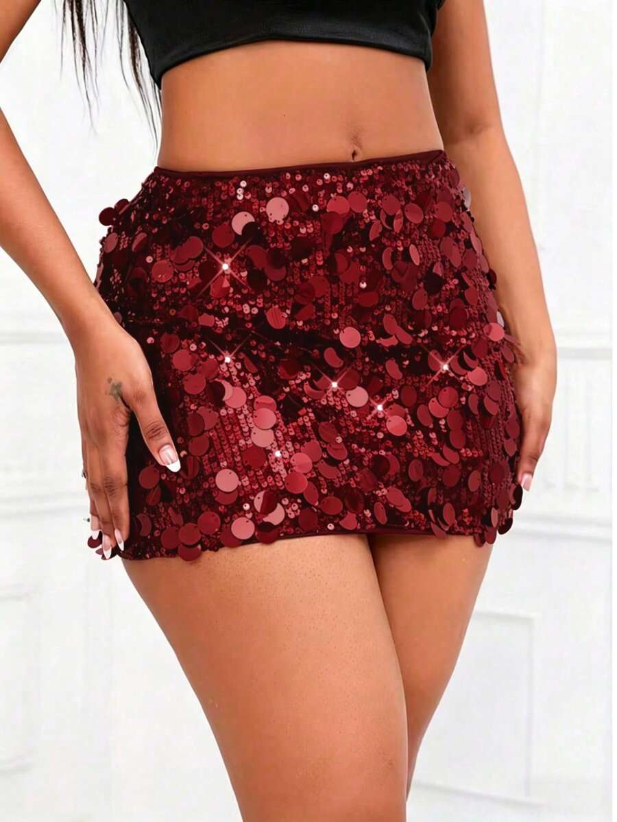 Women's high waist black sequin bodycon mini skirt featuring sparkling embellishments, unlined polyester fabric, ideal for night out and party wear.